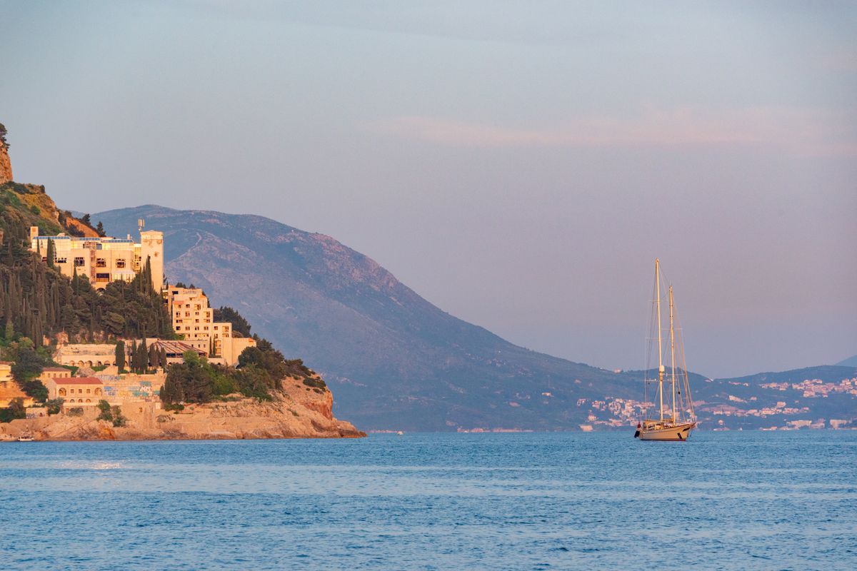 A couple enjoying a sunset on a luxury yacht, embodying a perfect romantic yacht charter in Croatia.